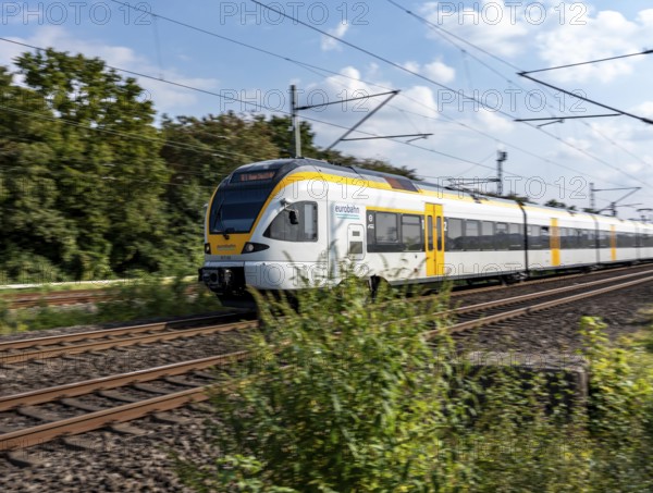 Train services on one of the busiest railway lines in Germany, regional services, RE3, Rhein-Emscher-Express, from Hamm via Dortmund, Gelsenkirchen and Duisburg to Düsseldorf, the Eurobahn, train between Duisburg and Düsseldorf, commuter trains, regional trains, ICE and IC long-distance services and freight services operate here, North Rhine-Westphalia, Germany