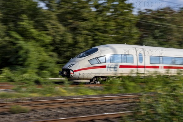 Train traffic on one of the busiest railway lines in Germany, ICE train between Duisburg and Düsseldorf, commuter trains, regional trains, ICE and IC long-distance trains and freight traffic, North Rhine-Westphalia, Germany