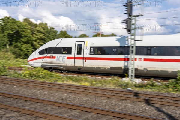 Train traffic on one of the busiest railway lines in Germany, ICE train between Duisburg and Düsseldorf, commuter trains, regional trains, ICE and IC long-distance trains and freight traffic, North Rhine-Westphalia, Germany