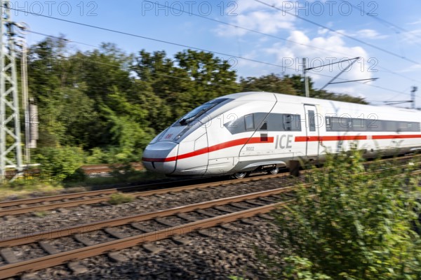 Train traffic on one of the busiest railway lines in Germany, ICE train between Duisburg and Düsseldorf, commuter trains, regional trains, ICE and IC long-distance trains and freight traffic, North Rhine-Westphalia, Germany