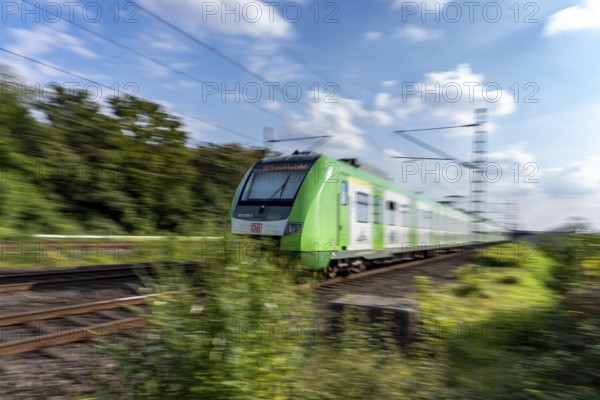 Train traffic on one of the busiest railway lines in Germany, regional traffic, S-Bahn S1, train between Duisburg and Düsseldorf, S-Bahn, regional trains, ICE and IC long-distance trains and freight traffic run here, North Rhine-Westphalia, Germany