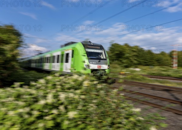 Train traffic on one of the busiest railway lines in Germany, regional traffic, S-Bahn S1, train between Duisburg and Düsseldorf, S-Bahn, regional trains, ICE and IC long-distance trains and freight traffic run here, North Rhine-Westphalia, Germany