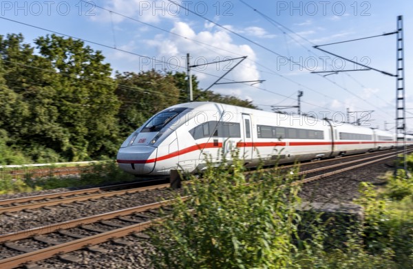 Train traffic on one of the busiest railway lines in Germany, ICE train between Duisburg and Düsseldorf, commuter trains, regional trains, ICE and IC long-distance trains and freight traffic, North Rhine-Westphalia, Germany