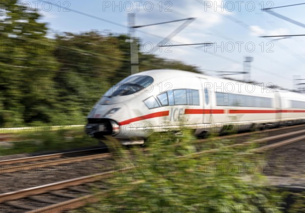 Train traffic on one of the busiest railway lines in Germany, ICE train between Duisburg and Düsseldorf, commuter trains, regional trains, ICE and IC long-distance trains and freight traffic, North Rhine-Westphalia, Germany