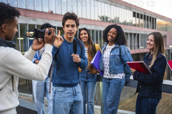 Group of diverse university students filming an interview on campus, one student speaking into a microphone while others are smiling and listening, capturing content for their online channel