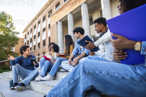Group of diverse university students sitting on campus steps, discussing and sharing ideas in an educational environment, representing friendship, youth, and multicultural learning
