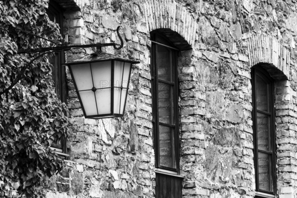 Old stone façade, historic lantern, Mühletorplatz, Feldkirch, Vorarlberg, Austria