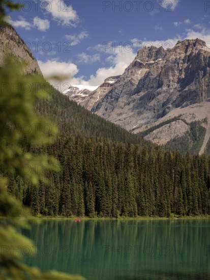 Peaceful Emerald Lake with reflection beside the Canadian Rocky Mountains and forest within Yoho National Park in Alberta, Canada, North Canada
