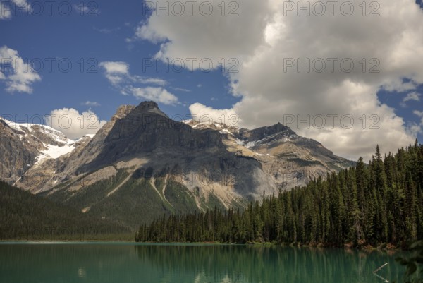 Majestic mountain range of the Canadian Rocky Mountains and Emerald Lake under a clear sky inside Yoho National Park, British Columbia, Canada, North America