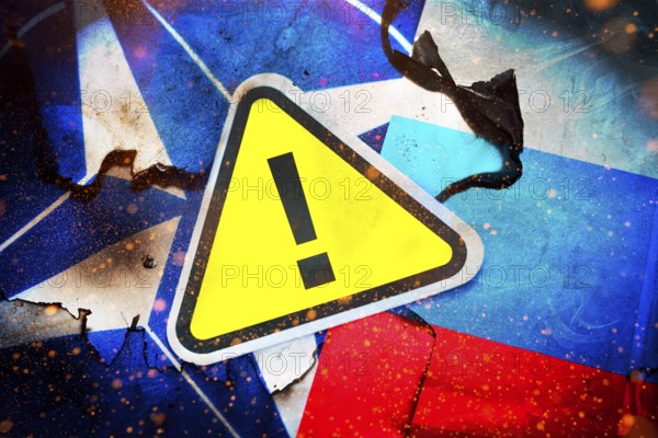 The flags of NATO and Russia with danger sign, photomontage