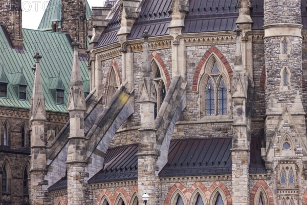 The Canadian Parliament building in gothic style with ornate stonework and a green roof in Ottawa, Ontario, Canada, North America