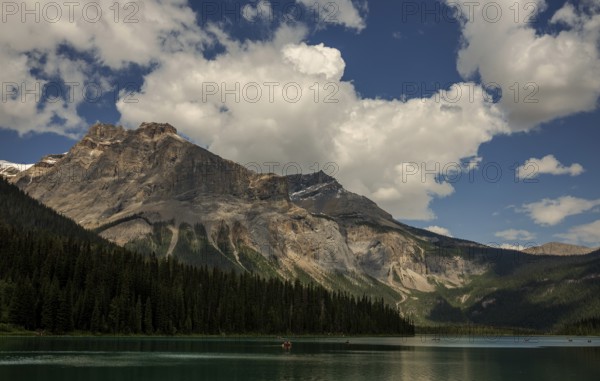 Majestic Canadian Rocky Mountains and tranquil Emerald Lake with a dramatic sky filled with clouds inside Yoho National Park, British Columbia, Canada, North America