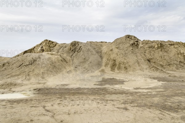 Outdoor shot of a light brown heap of earth
