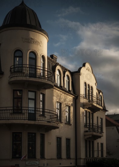 Sunlit historic European building with dramatic shadows against a cloudy sky in Helsingborg, Sweden, Scandinavia, Northern Europe