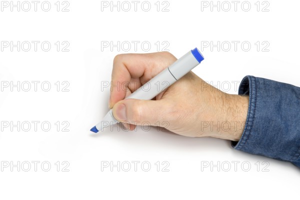 Male hand with felt tip pen in light back