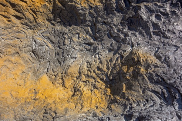 Full frame abstract bicolor rough stone surface