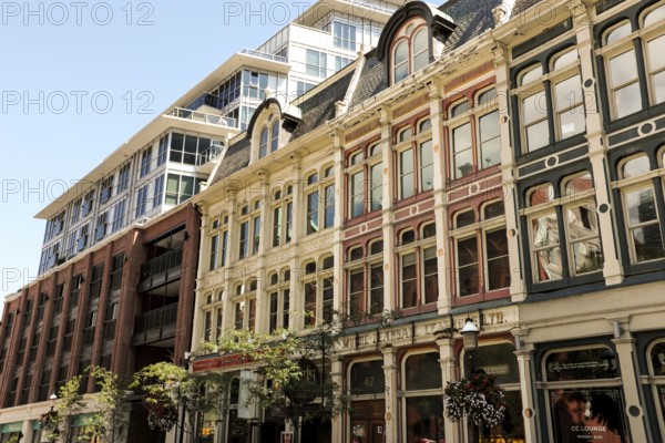 Row of historic buildings with ornate facades under a clear blue sky in Toronto, Ontario, Canada, North America