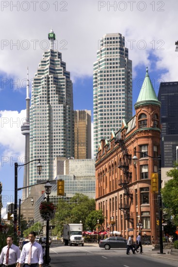 A mix of historic and modern buildings under a bright sky in Toronto, Ontario, Canada, North America