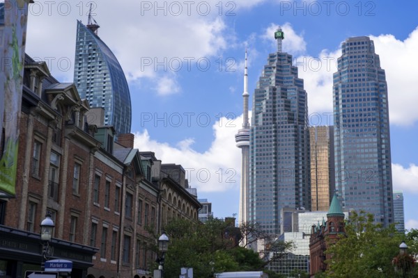 Toronto's skyline with the CN Tower and historic buildings on a sunny day in Toronto, Ontario, Canada, North America