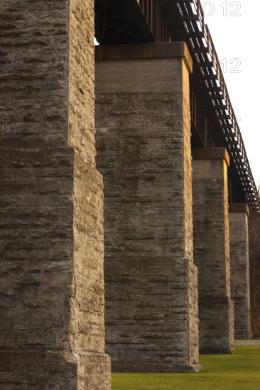 Close-up of a stone bridge in warm light, emphasizing texture and shadows in the industrial architecture in St. Marys, Ontario, Canada, North America