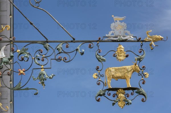 Wrought iron nose plate with golden bull in Kisslegg, Allgäu, Baden-Württemberg, Germany
