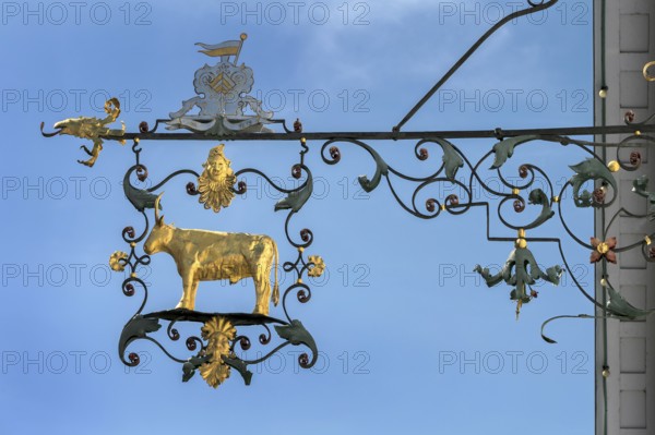 Wrought iron nose plate with golden bull in Kisslegg, Allgäu, Baden-Württemberg, Germany
