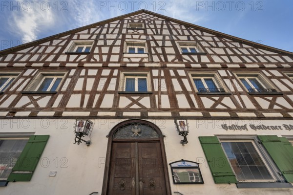 Pointed gable façade with half-timbering, Gasthof Goldener Adler in Kisslegg, Allgäu, Baden-Württemberg, Germany