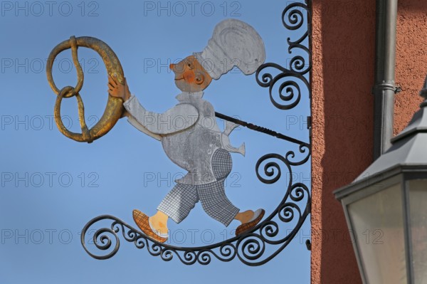 Nose sign, baker figure with pretzel in Kisslegg, Allgäu, Baden-Württemberg, Germany