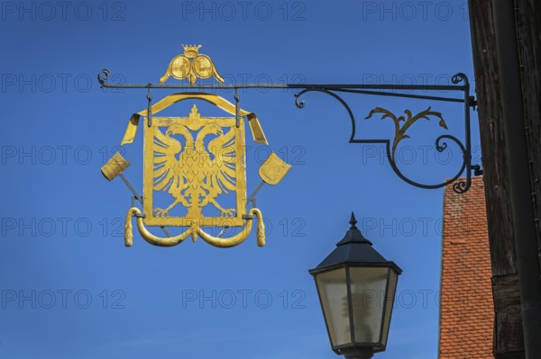 Nose shield with double eagle ind guild sign of the brewers and maltsters in Kisslegg, Allgäu, Baden-Württemberg, Germany