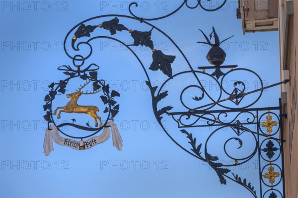 Nose sign with golden stag of the Deer-Post restaurant in Kisslegg, Allgäu, Baden-Württemberg, Germany