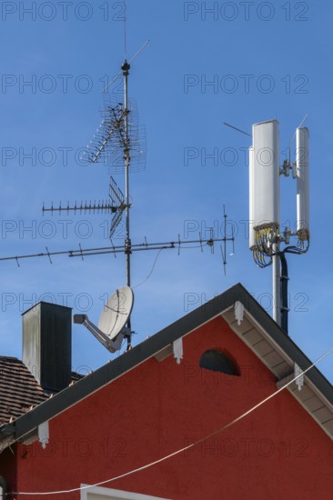 Red pointed gable with antennas and chimney, Allgäu, Baden-Württemberg, Germany