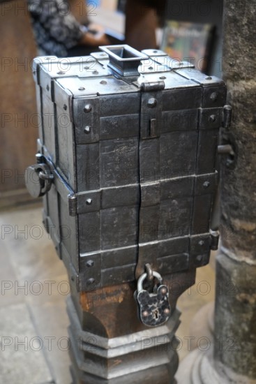 An antique metal box with a lock on a wooden floor, rustic and historic in appearance, St. Lawrence Church, Nuremberg, Middle Franconia, Franconia, Bavaria, Germany