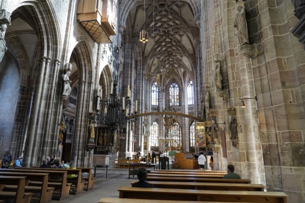 Large church room with pews and Gothic architecture, visited by people, Church of St. Lawrence, Nuremberg, Middle Franconia, Franconia, Bavaria, Germany