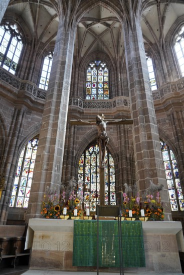 Church altar with cross and colourful stained glass windows in Gothic style, Church of St. Lawrence, Nuremberg, Middle Franconia, Franconia, Bavaria, Germany