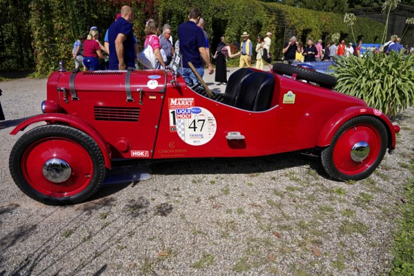 DKW, year of construction 1938, Oldtimer Classic, Gala International Concours d'Elegance Schwetzingen 2025, Germany, Europe, Red racing car at a competition, side view, surrounded by people on a sunny day
