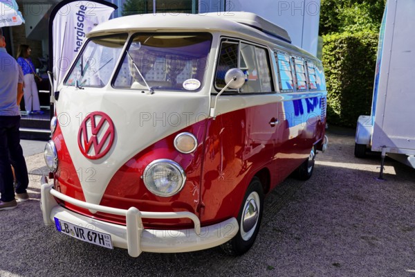 Oldtimer Classic, Gala International Concours d'Elegance Schwetzingen 2025, Germany, Europe, Classic VW Bulli in red and white on display in the sunshine