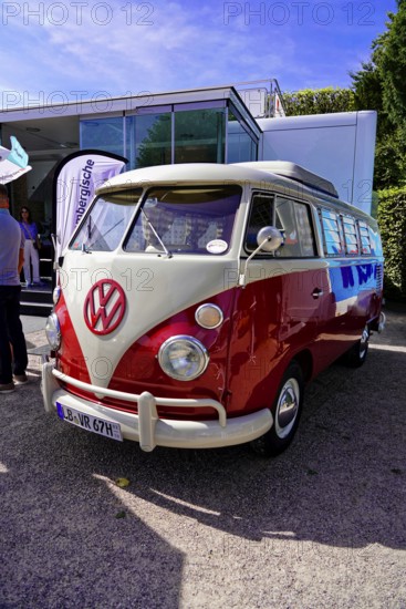 Oldtimer Classic, Gala International Concours d'Elegance Schwetzingen 2025, Germany, Europe, A red and white VW Bus classic car at a presentation in the sun