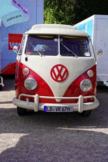Oldtimer Classic, Gala International Concours d'Elegance Schwetzingen 2025, Germany, Europe, A red and white VW Bus classic car stands in a car park in the sunshine