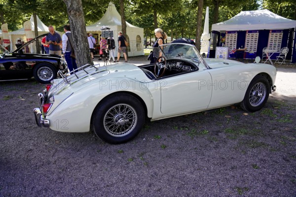 Oldtimer Classic, Gala International Concours d'Elegance Schwetzingen 2025, Germany, Europe, A white convertible vintage MG in a park at an exhibition