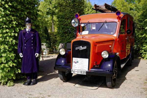 Oldtimer Classic, Gala International Concours d'Elegance Schwetzingen 2025, Germany, Europe, Historic fire engine next to a mannequin in uniform