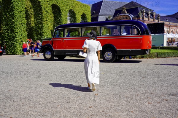 MERCEDES-BENZ 3500, built in 1950, retro bus in a park setting with a woman in the foreground, Oldtimer Classic, Gala International Concours d'Elegance Schwetzingen 2025, Germany