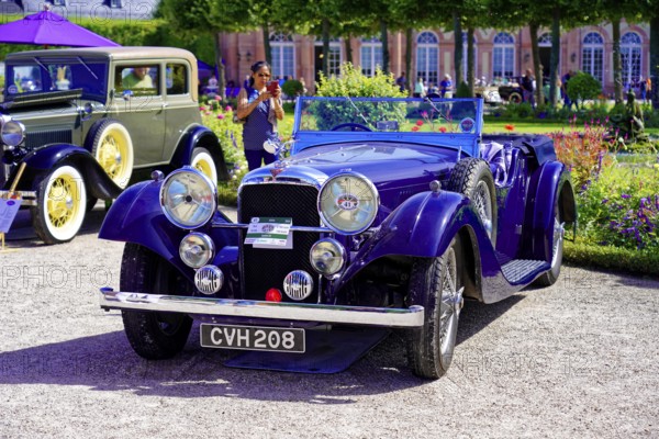 Oldtimer Classic, Gala International Concours d'Elegance Schwetzingen 2025, Germany, Europe, Blue classic car convertible at a sunny exhibition with flowering gardens in the background