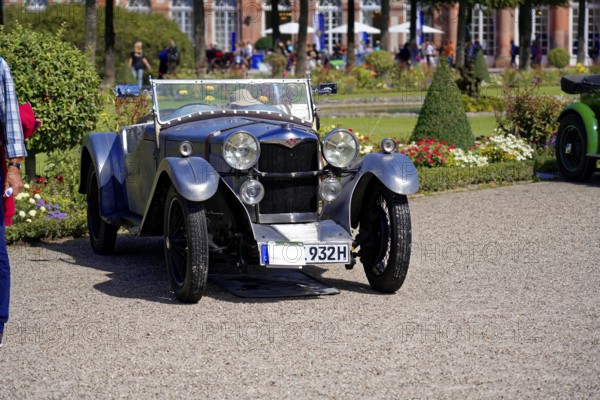 Oldtimer Classic, Gala International Concours d'Elegance Schwetzingen 2025, Germany, Europe, Classic vintage convertible with retro-black design in front of a well-tended landscape