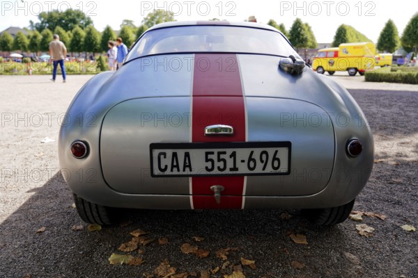 Masarati, Oldtimer Classic, Gala International Concours d'Elegance Schwetzingen 2025, Germany, Europe, Rear view of a silver classic car with red centre stripe on a car park