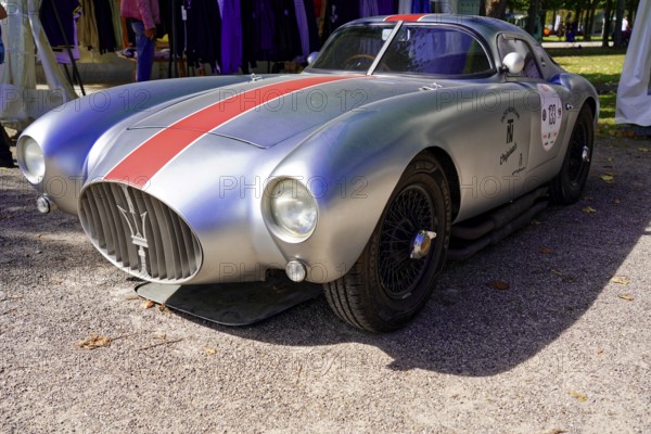 Masarati, Oldtimer Classic, Gala International Concours d'Elegance Schwetzingen 2025, Germany, Europe, Silver classic car with red stripe in retro style on a road