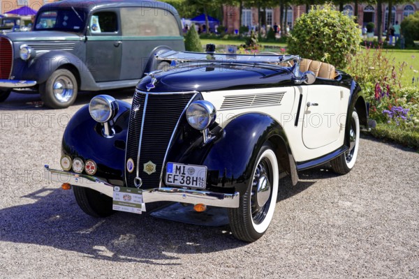 Oldtimer Classic, Gala International Concours d'Elegance Schwetzingen 2025, Germany, Europe, Black and white convertible in classic style, exhibited outdoors with other classic cars