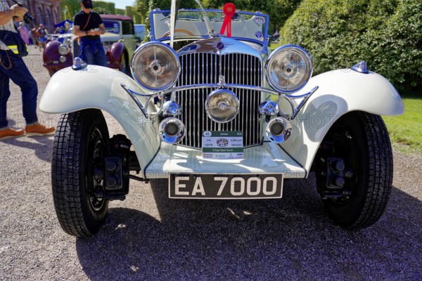 Oldtimer Classic, Gala International Concours d'Elegance Schwetzingen 2025, Germany, Europe, An elegant white classic car with gleaming headlights on a gravelled surface