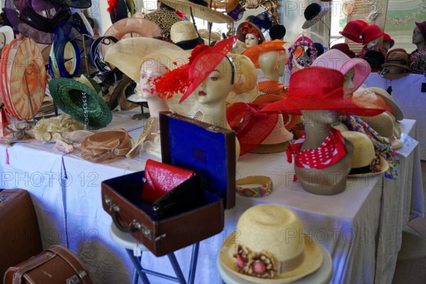 Oldtimer Classic, Gala International Concours d'Elegance Schwetzingen 2025, Germany, Europe, A multitude of colourful hats on mannequins in a bright room
