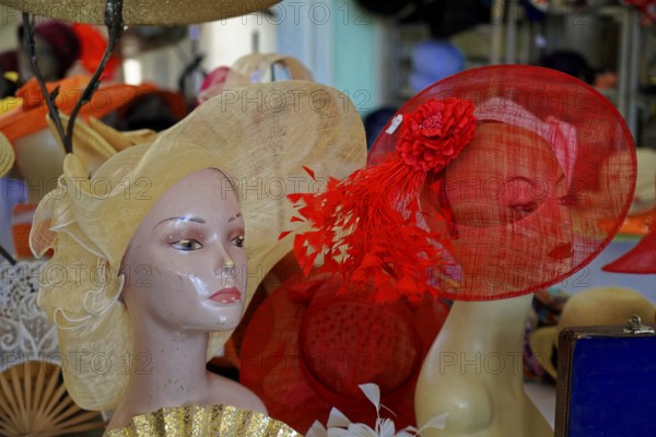 Oldtimer Classic, Gala International Concours d'Elegance Schwetzingen 2025, Germany, Europe, Mannequin with stylish red and beige hats in a vintage setting