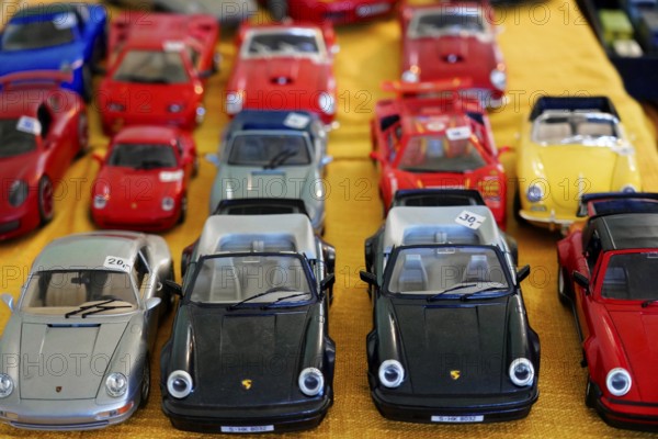 Oldtimer Classic, Gala International Concours d'Elegance Schwetzingen 2025, Germany, Europe, Various colourful model cars, mainly Porsche, arranged on a table